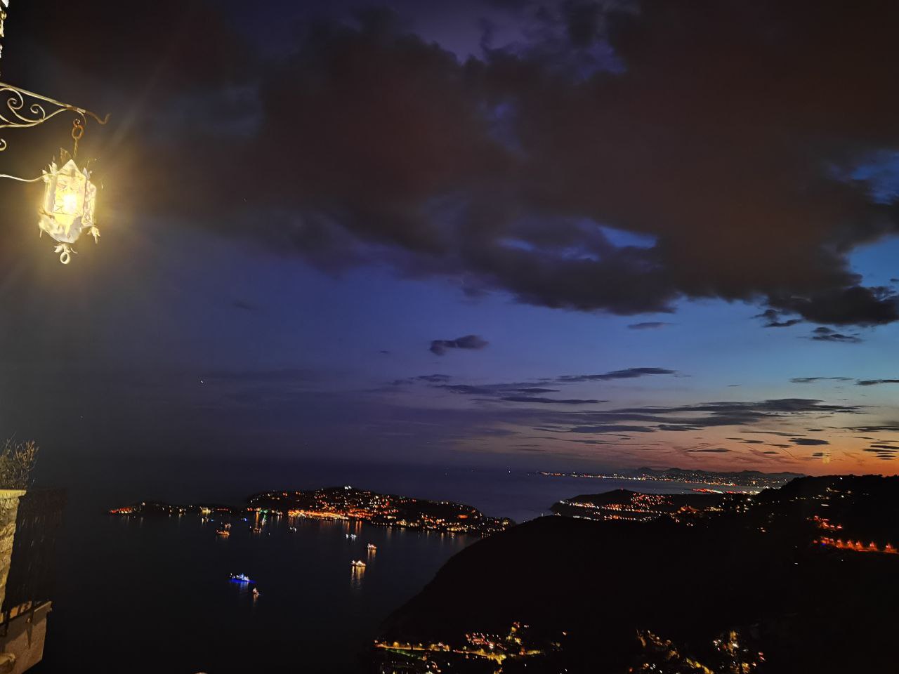 A night panorama of sea and lights taken in Eze, France